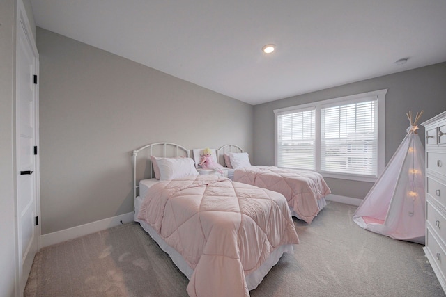 bedroom with light carpet