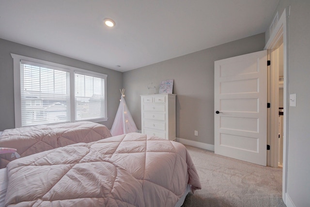 bedroom with light colored carpet