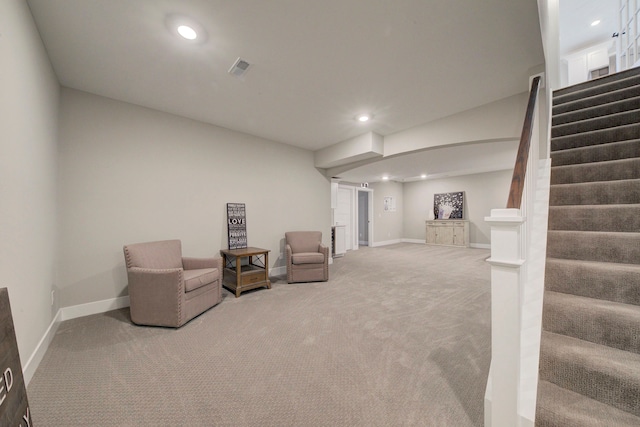 sitting room featuring carpet flooring