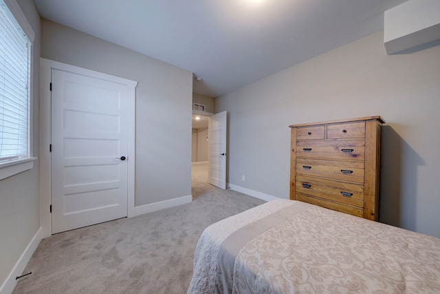 bedroom with light colored carpet