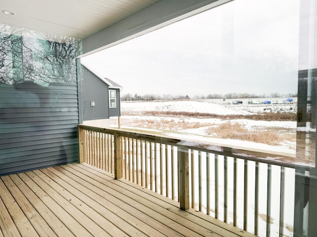 view of snow covered deck