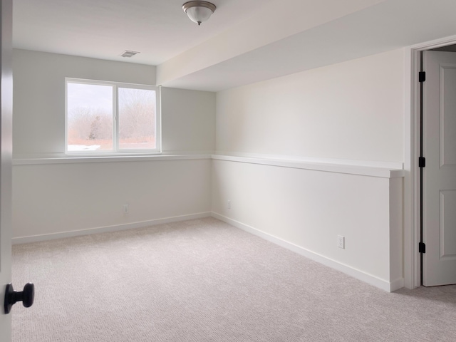 spare room with light colored carpet