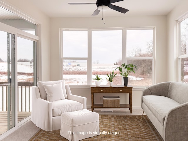 sunroom with ceiling fan