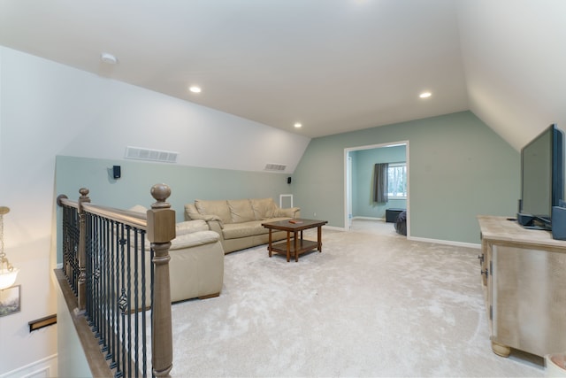 living room with carpet flooring and vaulted ceiling