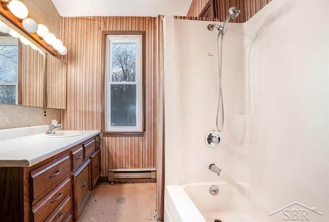 bathroom with a baseboard heating unit, shower / tub combination, and vanity