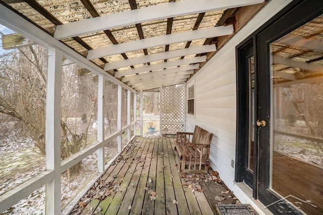 unfurnished sunroom with vaulted ceiling