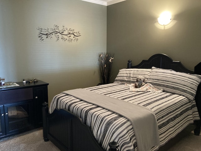 bedroom featuring carpet and ornamental molding