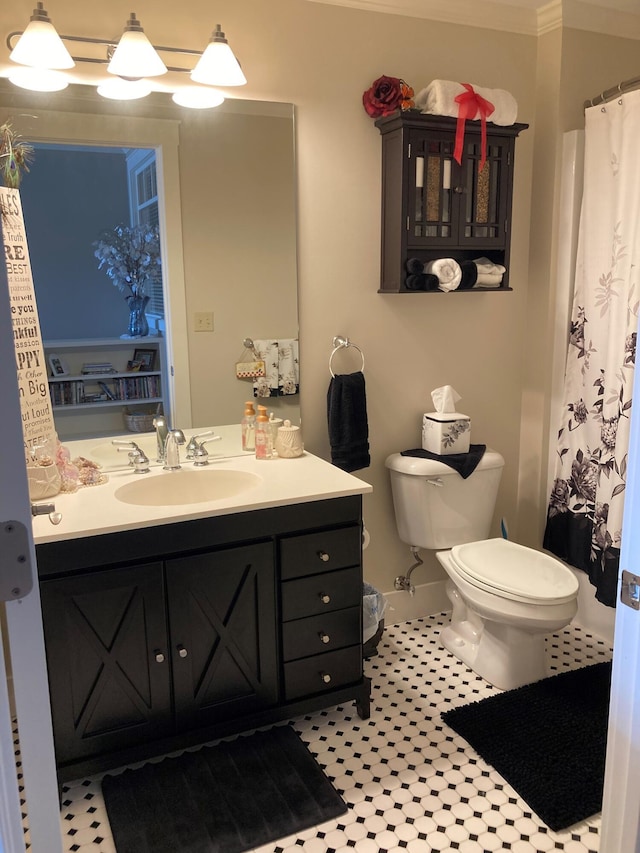 bathroom featuring tile patterned floors, vanity, and toilet