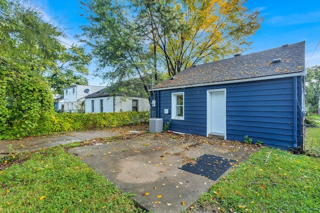 back of house featuring cooling unit and a patio