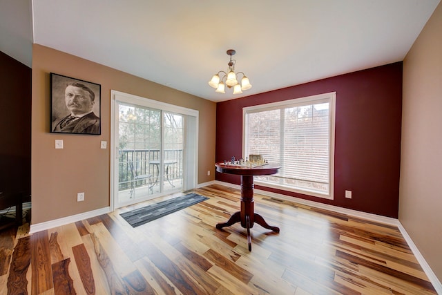 dining area featuring a chandelier and hardwood / wood-style floors