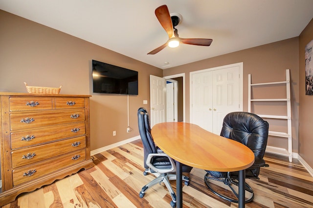 office space featuring light hardwood / wood-style floors and ceiling fan