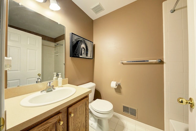 bathroom featuring tile patterned flooring, vanity, and toilet