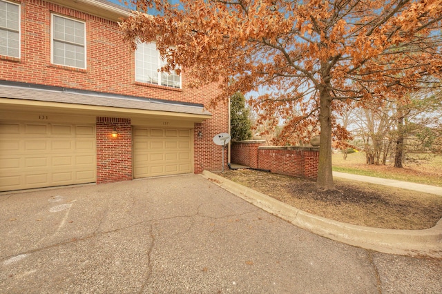 view of property exterior with a garage