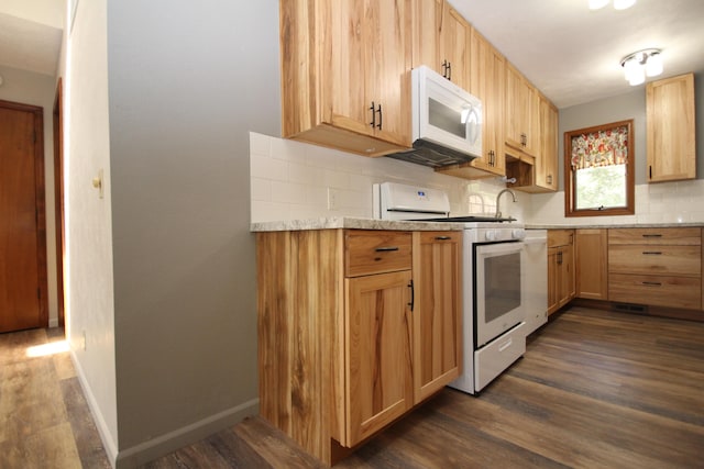 kitchen with decorative backsplash, dark hardwood / wood-style floors, and white appliances