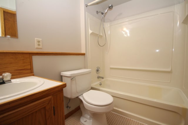 full bathroom featuring bathing tub / shower combination, tile patterned flooring, vanity, and toilet