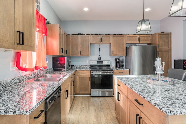 kitchen featuring stainless steel appliances, sink, light wood-type flooring, light stone countertops, and pendant lighting