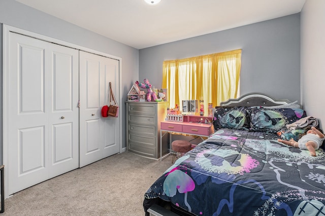 bedroom with a closet and light carpet