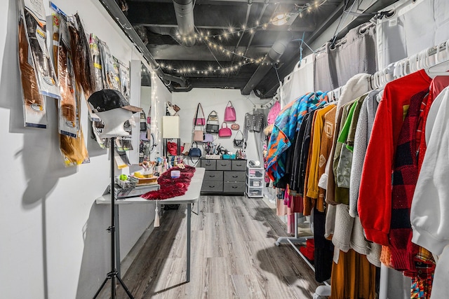 spacious closet featuring hardwood / wood-style flooring