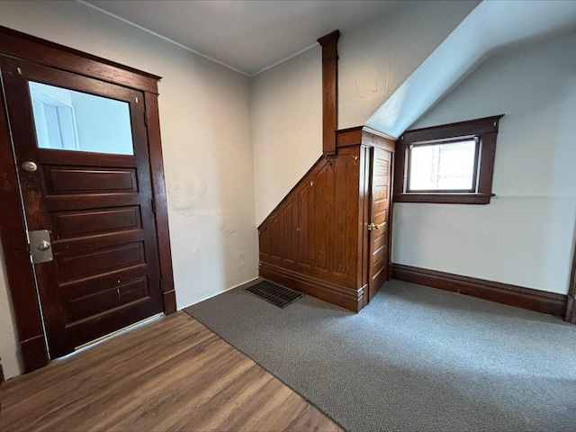 foyer entrance with carpet