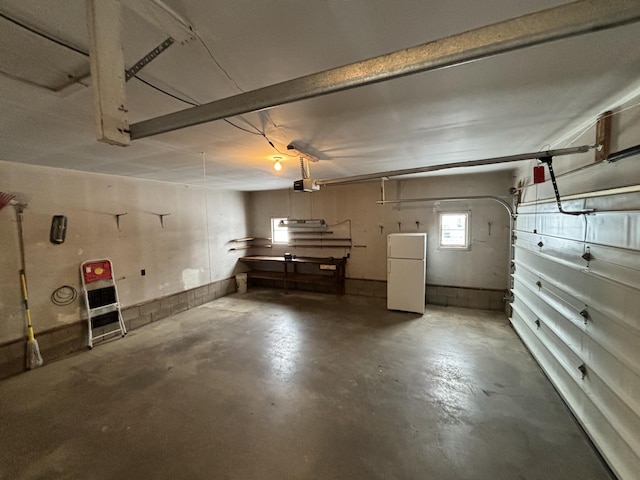 basement featuring white refrigerator