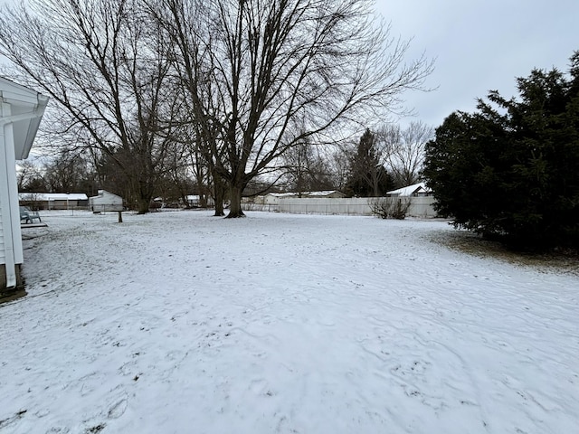 view of yard covered in snow