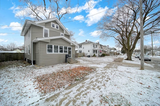 view of snow covered house