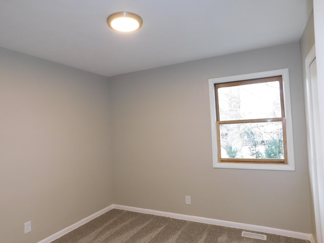 empty room with carpet flooring