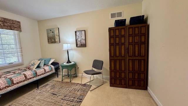 interior space with carpet, baseboards, and visible vents