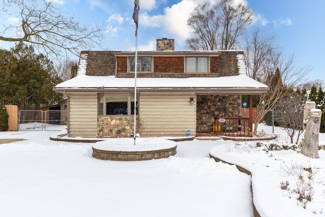 view of snow covered house