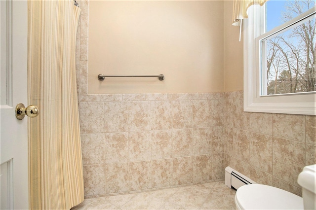 bathroom featuring toilet and a baseboard radiator