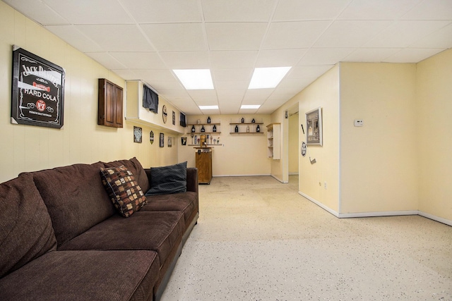 living room featuring a paneled ceiling