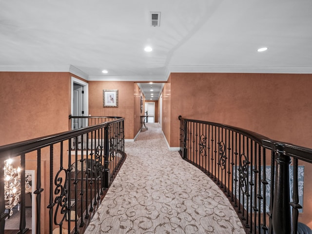 corridor featuring light colored carpet and ornamental molding