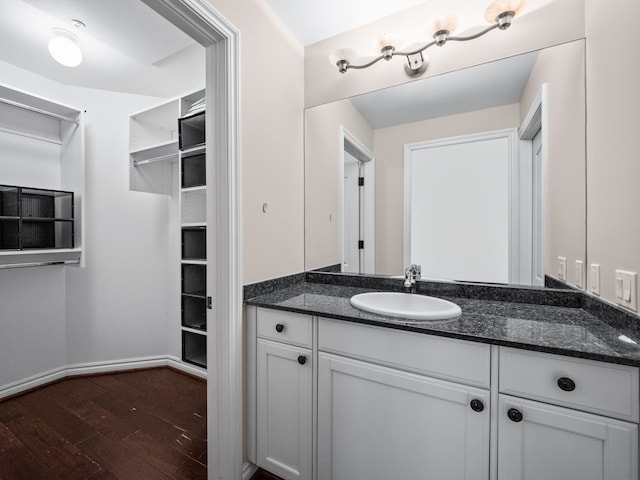 bathroom featuring hardwood / wood-style floors and vanity