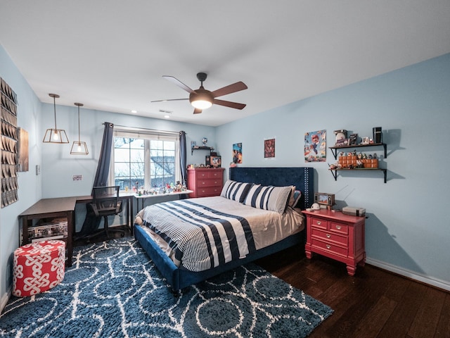 bedroom featuring ceiling fan and dark hardwood / wood-style flooring