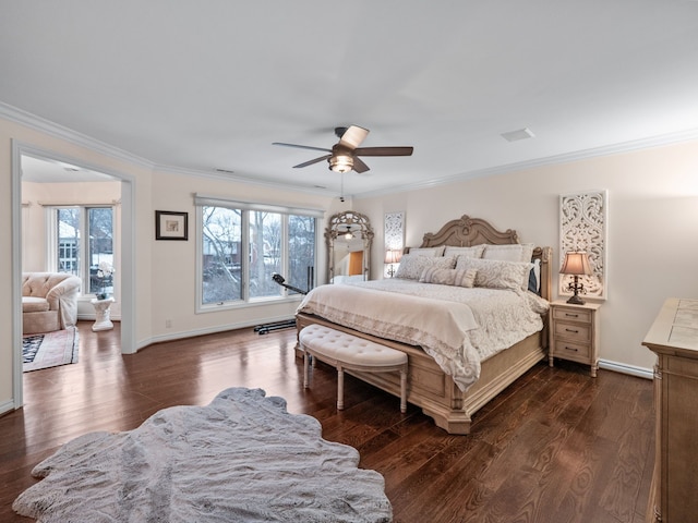 bedroom featuring multiple windows, ceiling fan, and ornamental molding