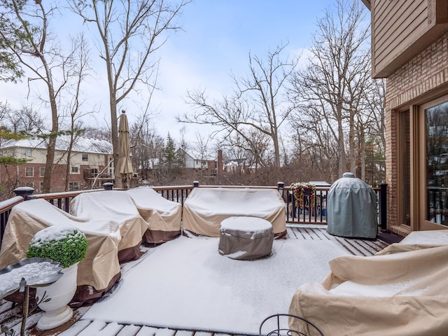 snow covered deck with area for grilling