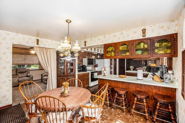 dining space featuring a notable chandelier