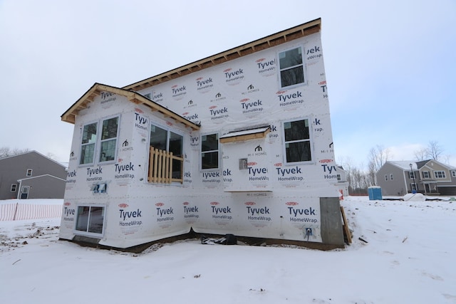 view of snow covered house