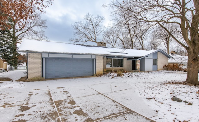 ranch-style house featuring a garage