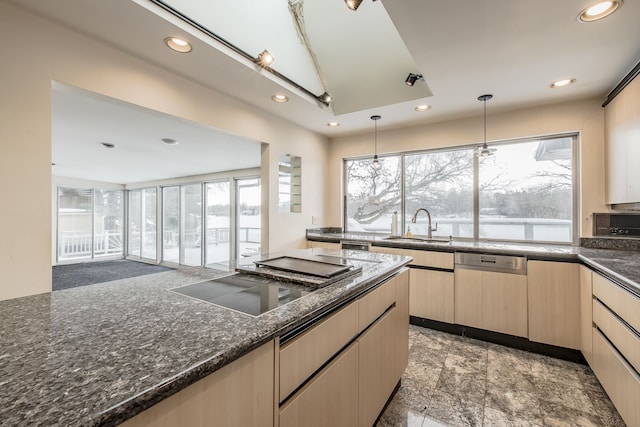 kitchen with black electric stovetop, sink, light brown cabinetry, decorative light fixtures, and dishwashing machine