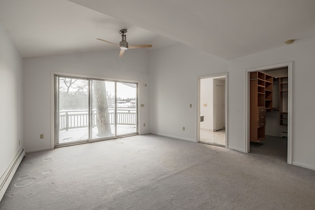 carpeted spare room with ceiling fan, lofted ceiling, and a baseboard heating unit