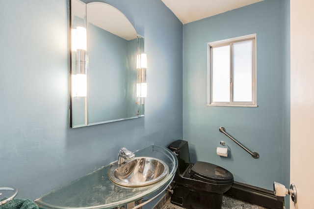 bathroom with toilet and sink