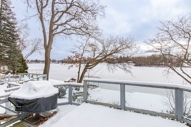 snow covered deck featuring grilling area