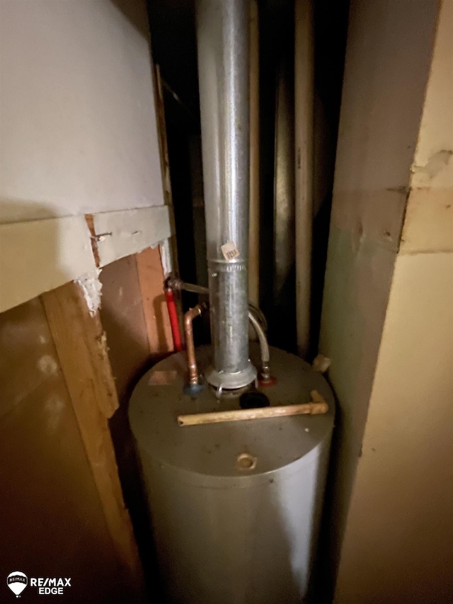 utility room featuring water heater