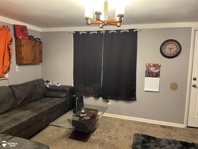 living room with carpet and a chandelier