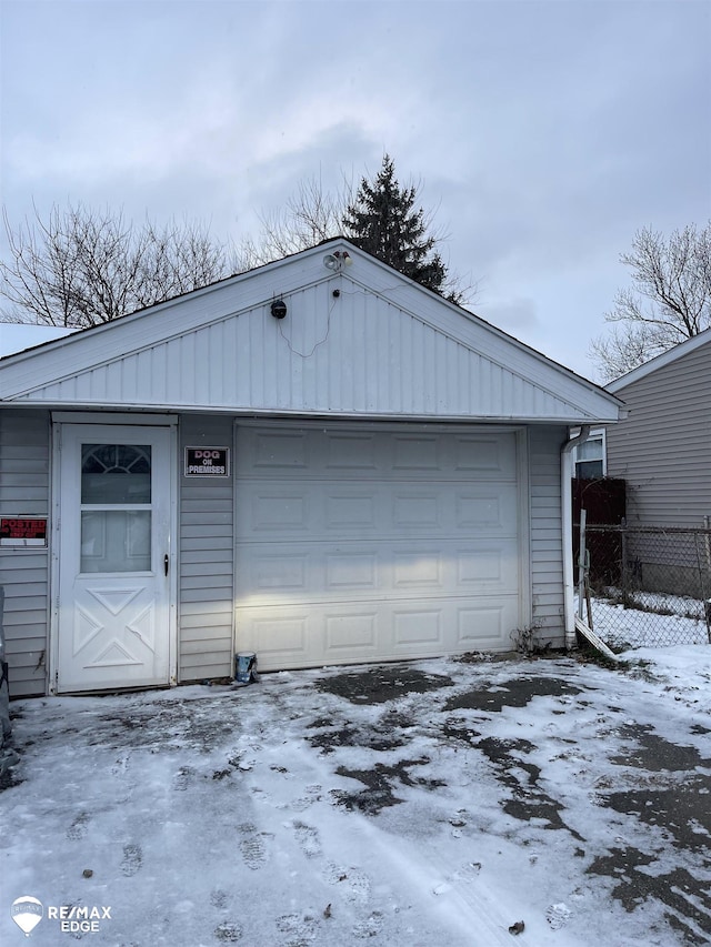 view of snow covered garage