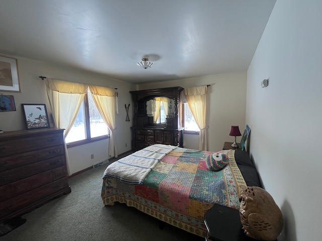 carpeted bedroom featuring multiple windows