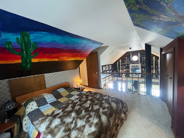 bedroom featuring lofted ceiling and carpet floors