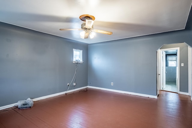 spare room featuring dark hardwood / wood-style floors and ceiling fan