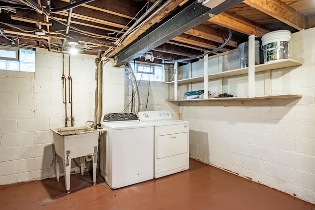 washroom featuring separate washer and dryer and sink